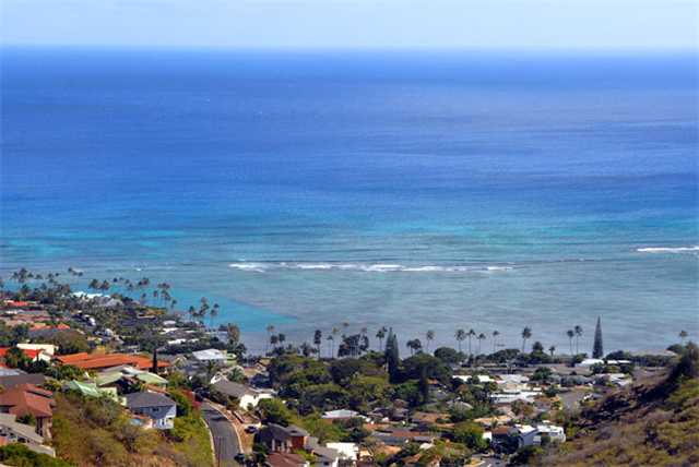 View of hillside with houses and ocean from Kahala Kua home