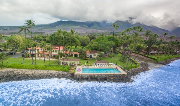 Birds eye view of the Puamana ocean pool , club house and the scenic West Maui Mountains